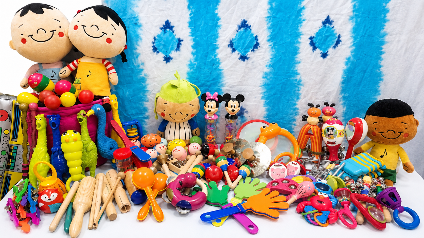 Collection of colorful Zumbini free-play instruments and toys