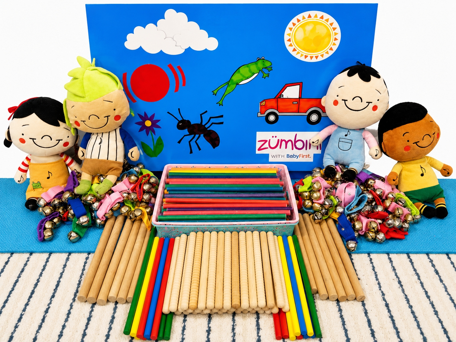 Zumbini rhythm sticks and jingle bells with Zumbini character dolls